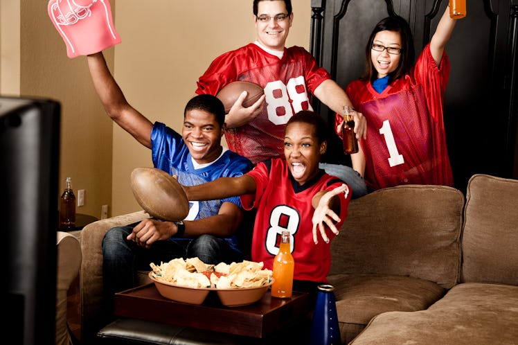 Football fans cheering on the Super Bowl