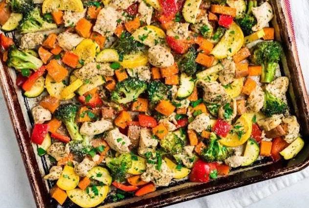 Sheet pan chicken with rainbow vegetables recipe from Well Plated by Erin is a fast, healthy, kid-ap...