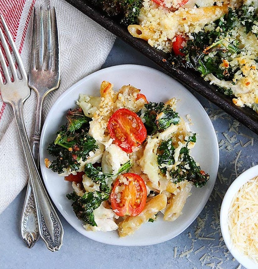Sheet pan pasta bake recipe from Two Peas & Their Pod includes chicken, penne pasta, and cherry toma...