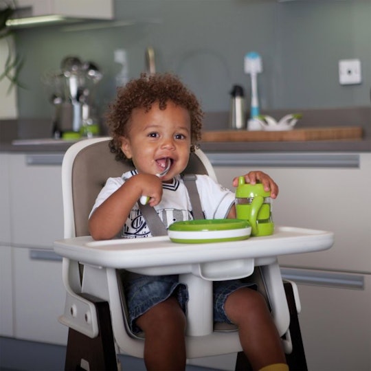 a toddler sitting in the OXO Tot Sprout highchair