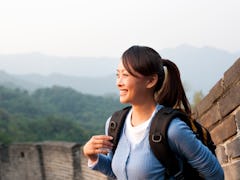 Young Asian woman hiking, Great Wall of China