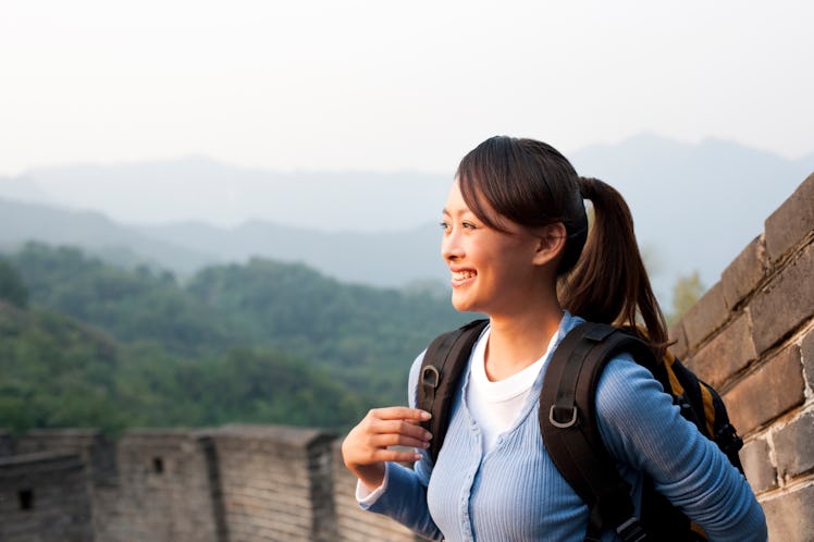 Young Asian woman hiking, Great Wall of China