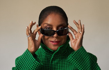 Phylicia Rashad in a Balenciaga green jacket and black sunglasses