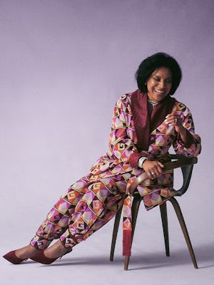 Phylicia Rashad posing in a Dapper Dan suit, Bulgari necklace and earrings, a David Yurman necklace ...