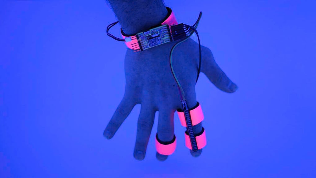 A hand equipped with the Dormio glove prototype.