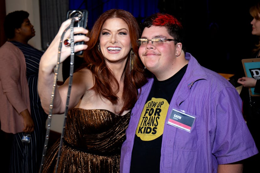 Debra Messing and Gavin Grimm take a selfie together at the 2019 DoSomething Gala  in April 2019 in ...