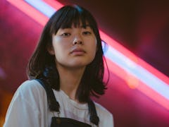 Young woman, neon sign