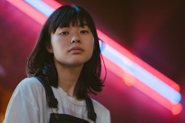 Young woman, neon sign