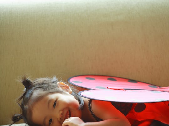 child wearing ladybug costume