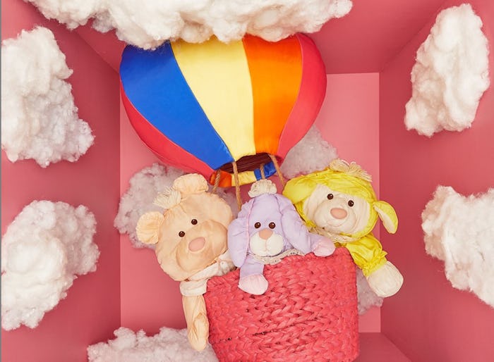 Fisher-Price toy museum photo of three "Puffalump" toys in a mini hot air balloon