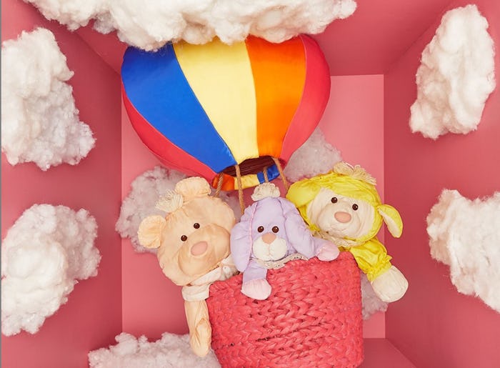 Fisher-Price toy museum photo of three "Puffalump" toys in a mini hot air balloon 