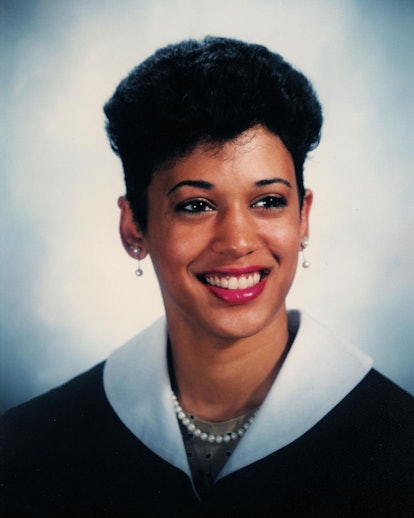 A portrait of young Kamala Harris, smiling in a black dress with a white collar, a pearl necklace an...