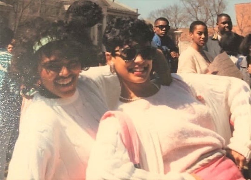 Kamala Harris and her sorority sister posing in white sweaters, pink pants and pearl earrings