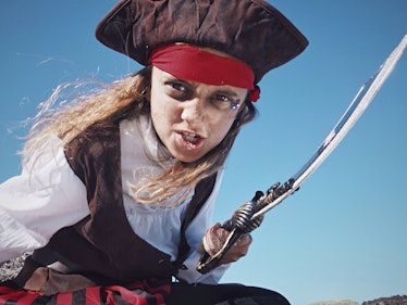 Little girl wearing pirate costume