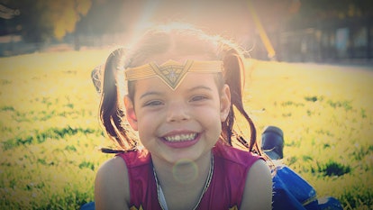 Little girl in superhero costume