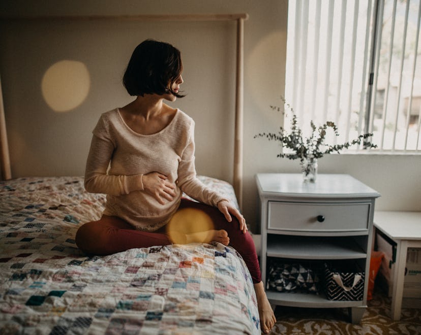 pregnant woman on bed