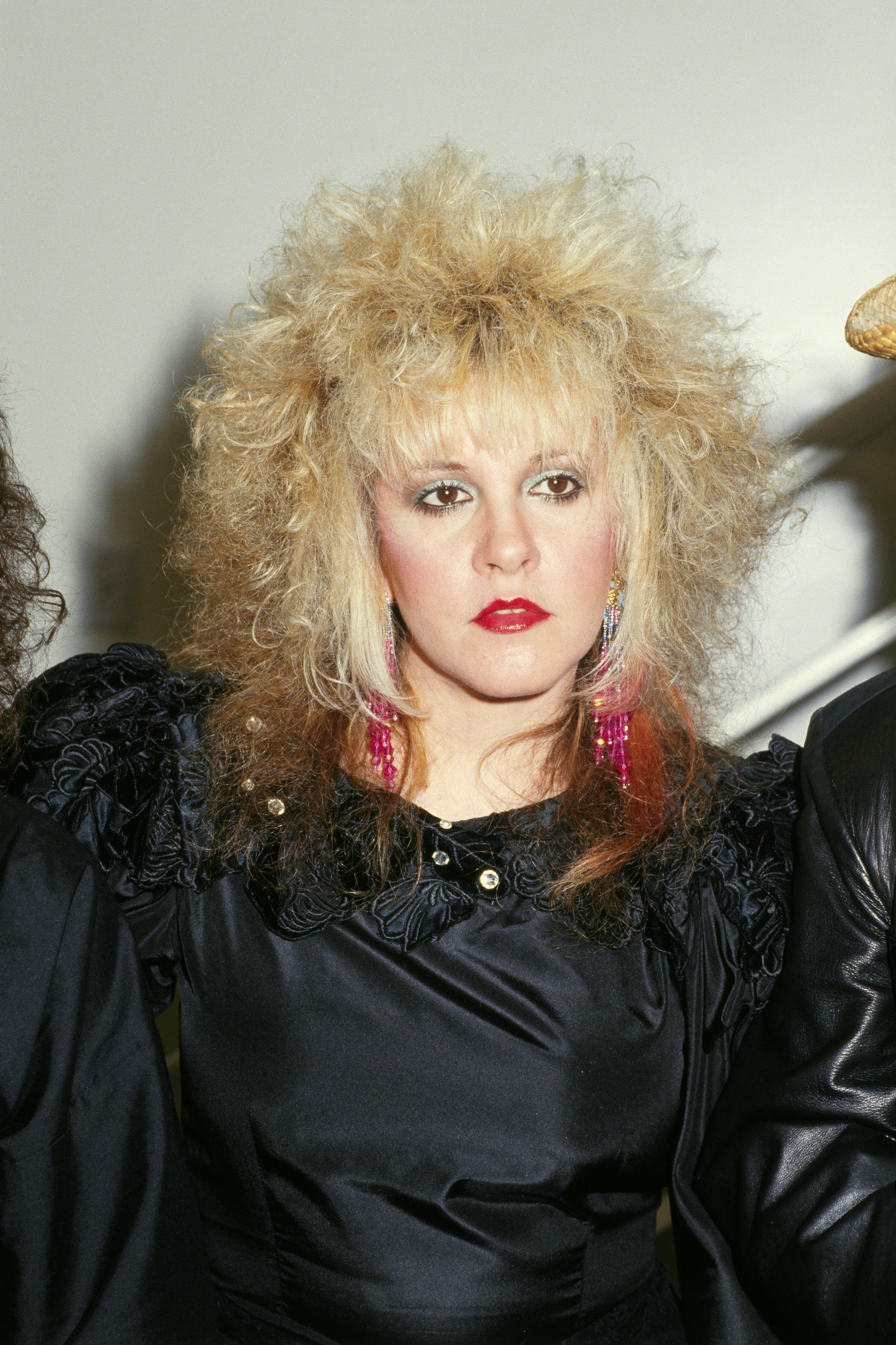 Stevie Nicks with blonde hair that's streaked red.