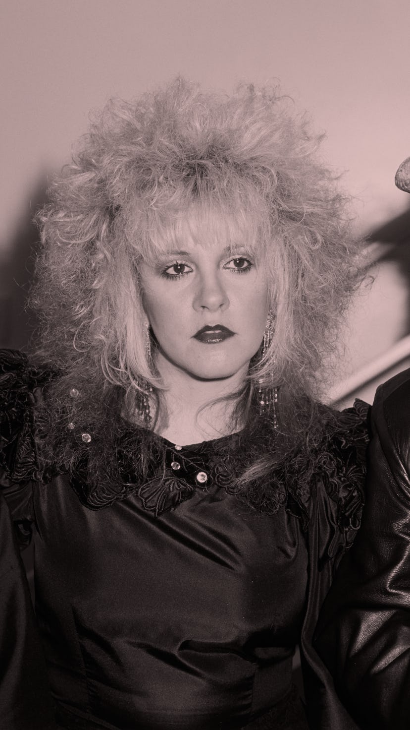 Stevie Nicks with blonde hair that's streaked red.