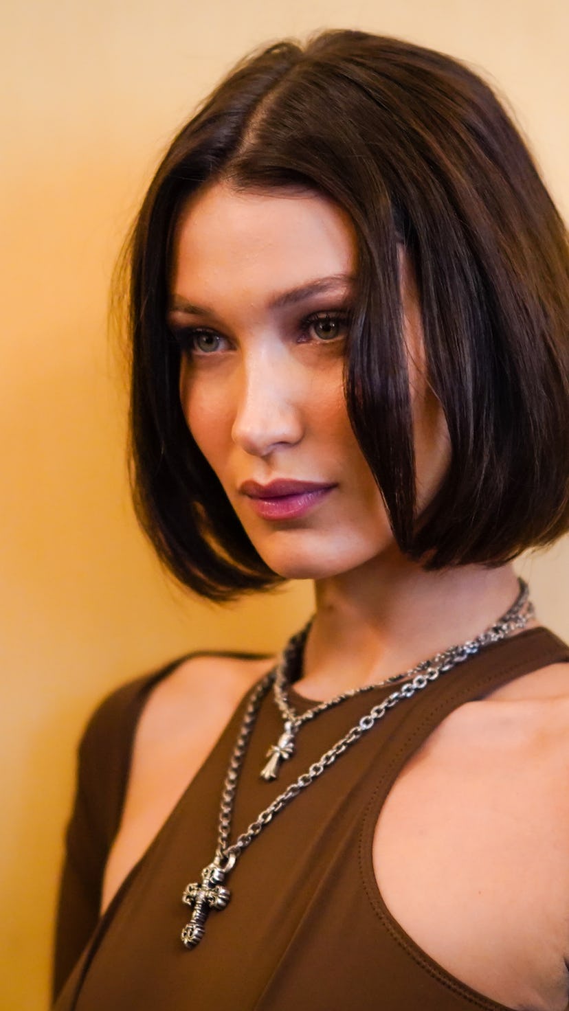 Model Bella Hadid with a middle-part brown bob.