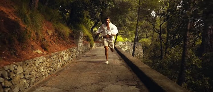 Harry Styles runs on a hiking trail in Italy. 