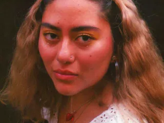 Nereida Ortiz, a DACA recipient, looks directly into the camera