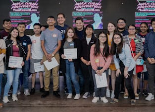 Mark Cuban and bootcamp graduates holding certificates