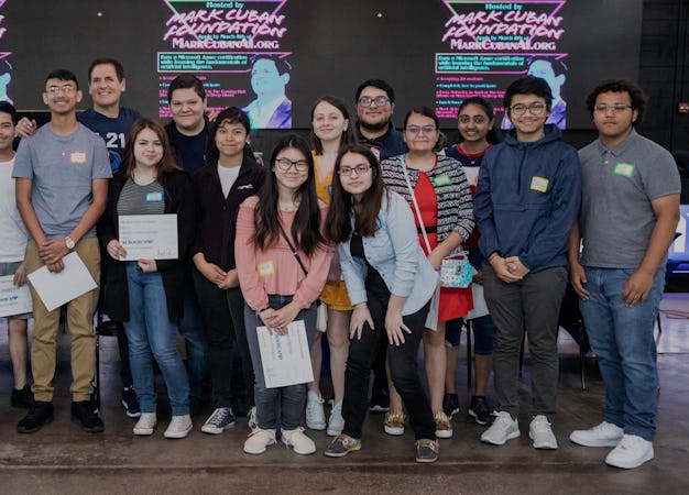 Mark Cuban and bootcamp graduates holding certificates