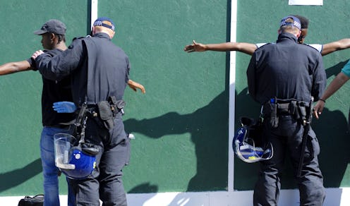 The Met police stop and search two Black men.