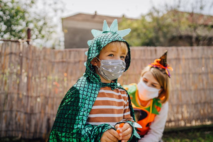 little boy in dragon halloween costume