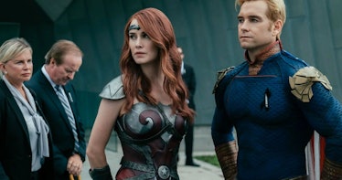 Maeve, a Halloween costume for redheads, stands next to Homelander in their armor.