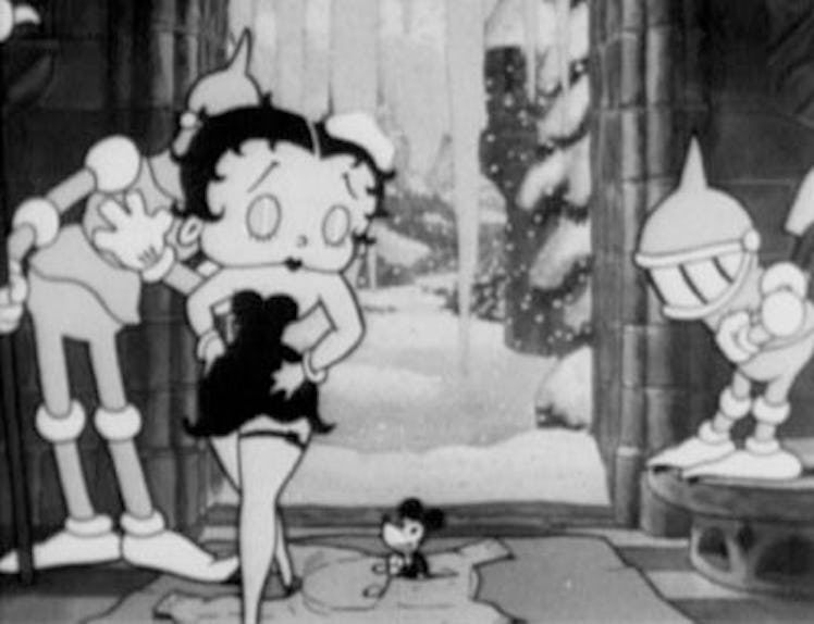 Betty Boop in black and white walking next to a mouse.