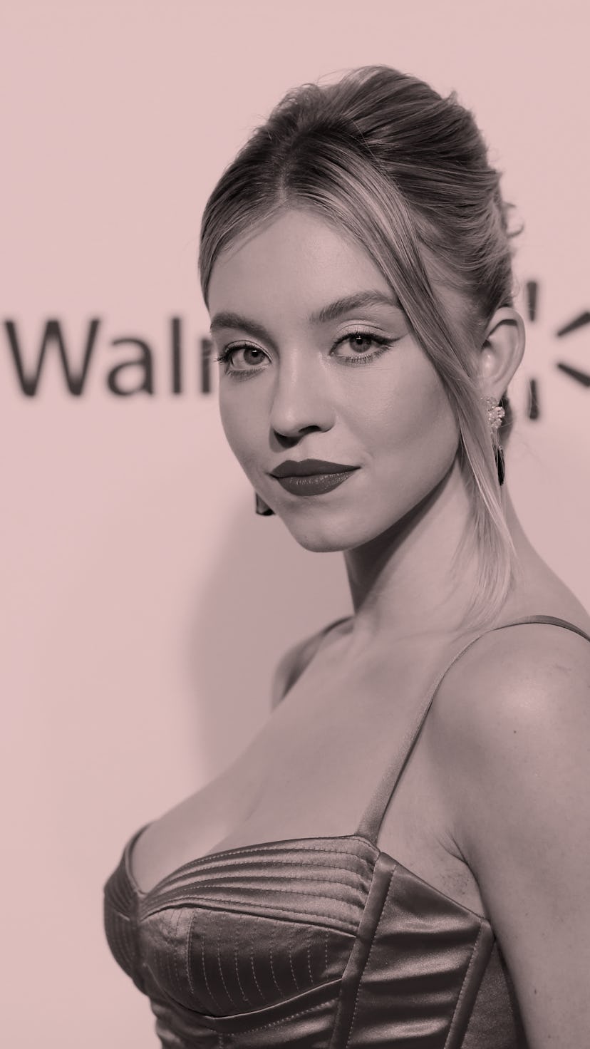 Actress Sydney Sweeney on the red carpet with red lipstick.