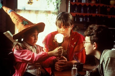 Marney and her siblings gather around a crystal ball in 'Halloweentown.'