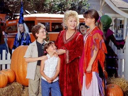 The main characters from 'Halloweentown' gather in the town square, surrounded by bales of hay and p...