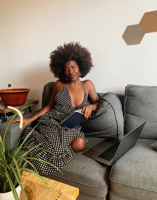 Sade Mims wears a stylish gingham dress while she works from home