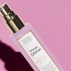 Sunday Riley Pink Drink Firming Resurfacing Essence close-up, in bottle.