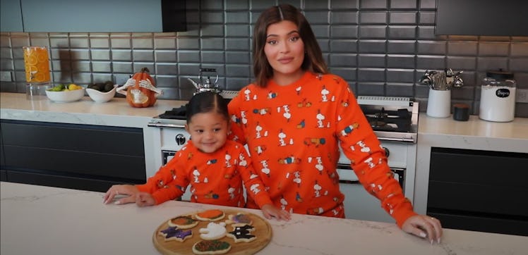 Kylie Jenner and daughter Stormi bake cookies.