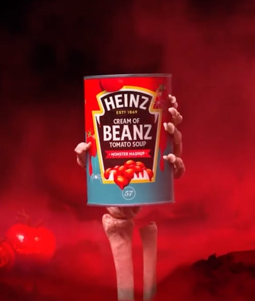 A tin of Heinz cream of beanz tomato soup with a red label and skeleton hand clutching it