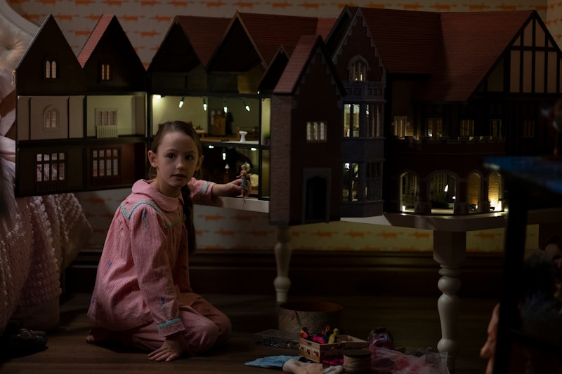 Flora and her dollhouse in 'The Haunting of Bly Manor' via the Netflix press site