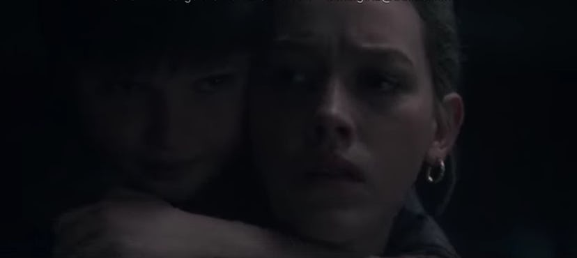 Miles wraps his arms around Dani's neck in 'The Haunting of Bly Manor'
