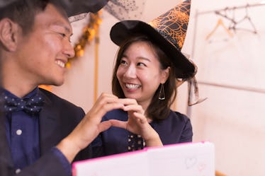 Young couple in Halloween costumes