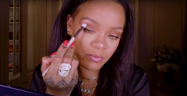 Rihanna holds Fenty Beauty eyeshadow brush