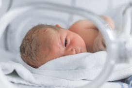 premature baby in NICU isolette