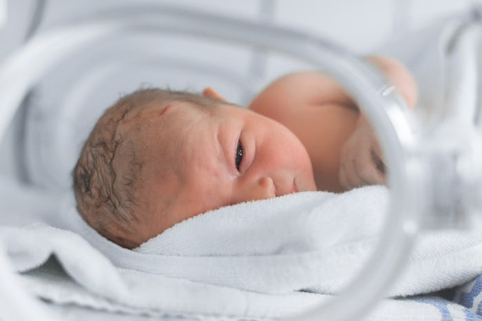 premature baby in NICU isolette