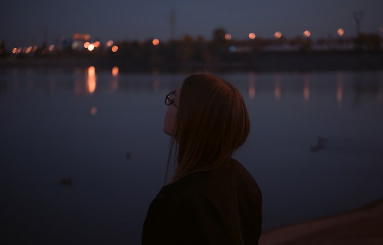 Young woman near water