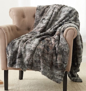 If you're looking for warm blankets that feel silky soft, consider this faux fur blanket.