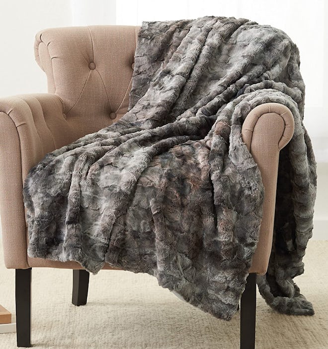 If you're looking for warm blankets that feel silky soft, consider this faux fur blanket.