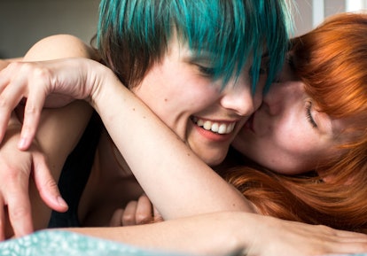 Lesbian couple cheek kiss