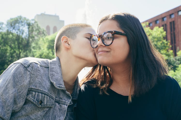 Lesbian couple kiss on cheek