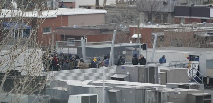 Dozens of people are on the roof of Ubisoft's Montreal office, some of whom barricaded the access do...
